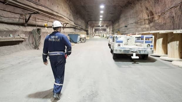 Rocanville PotashCorp underground production supervisor Dave Esslinger walks toward his work vehicle 1,000 metres below the surface at the potash mine in Saskatchewan.