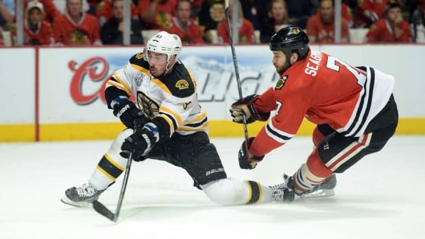 Defenceman Brent Seabrook (7) and the Chicago Blackhawks got the better of Brad Marchard, left, and the Boston Bruins in Game 5.