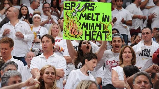 A fan holds up a sign prior to the start of Game 7 of the NBA Finals between the Miami Heat and the San Antonio Spurs on Thursday.