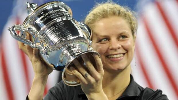 Kim Clijsters of Belgium hoists the winner's trophy following a 6-2, 6-1 victory over Vera Zvonareva on Sept. 11, 2010.