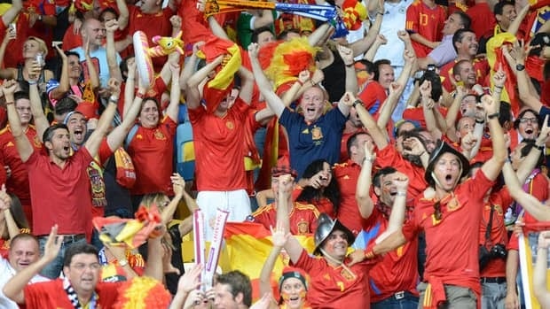 Spanish fans celebrate after a goal during the Euro 2012 final match between Spain and Italy on July 1, 2012 at the Olympic Stadium in Kiev.