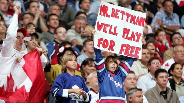 A young fan, shown here in 2004, holds up a sign directed at NHL President Gary Bettman during the 2004-05 lockout.
