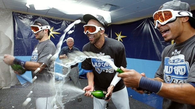 Find out how some of David Price's Tampa Bay Rays teammates, including Sean Rodriguez, left, and coach Joe Maddon, celebrated their ace's Cy Young Award on Twitter.