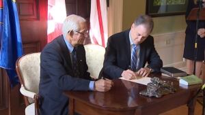 nl keith hutchings fisheries minister signing