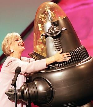 Forbidden+CP Anne Francis hugs her Forbidden Planet co-star Robbie the Robot during ...