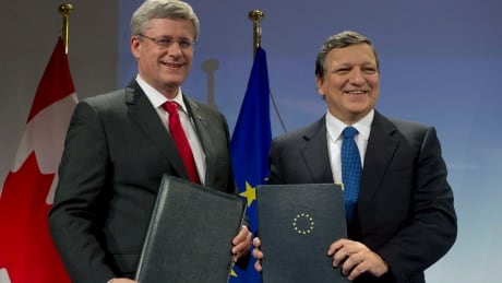 Prime Minister Stephen Harper stands with European Commission President Jose Manuel Barroso after signing an agreement in principal on trade Friday at the European Commission in Brussels, Belgium. Canada-EU trade deal reached in principle