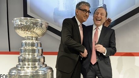 NHL Commissioner Gary Bettman (L) and Rogers Communications President and CEO Nadir Mohamed (R) attend a news conference in Toronto November 26, 2013. Rogers Communications and the NHL today announced a 12-year broadcast and multimedia agreement that includes all national rights to NHL games in all platforms in all languages. REUTERS/Aaron Harris NHL, Rogers ink deal