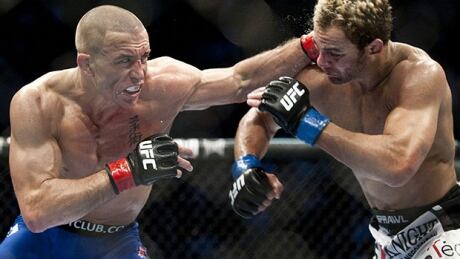 Georges St-Pierre, left, silenced lippy Josh Koscheck to retain his UFC welterweight belt in a December 2010 bout at Montreal's Bell Centre. St-Pierre has since run his streak of successful title defences to nine. st-pierre-101212-620