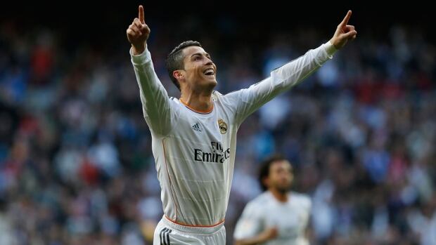 Real Madrid's Cristiano Ronaldo celebrates his goal against Granada at the Santiago Bernabeu stadium in Madrid, Spain, on Saturday.