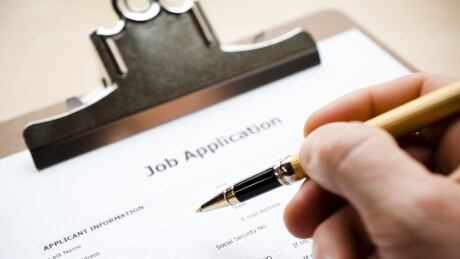 Job application form on a clipboard. Job application