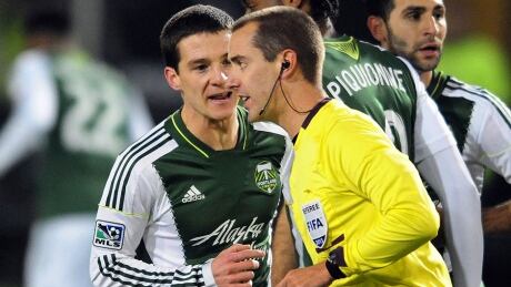 Mark Geiger, right, and other Major League Soccer referees and other on-field officials were locked out Friday, a day before the season openers. geiger-mark