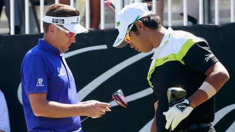 Hideki Matsuyama of Japan, right, and Ian Poulter of England wait on the first tee during the third round of the World Golf Championships-Cadillac Championship at Trump National Doral on Saturday in Doral, Fla. Poulter was upset that Matsuyama damaged a putting surface during the second round. Ian Poulter, Hideki Matsuyama