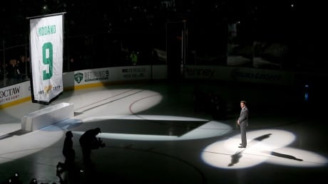 Former Dallas Star Mike Modano has his jersey retired before the Stars played the Minnesota Wild on Saturday at American Airlines Center in Dallas. Mike Modano