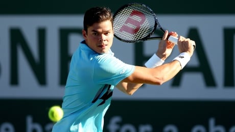 Milos Roanic of Canada returns a shot to Edouard Roger-Vasselin of France during the BNP Parabas Open at the Indian Wells Tennis Garden on Saturday. 78914613