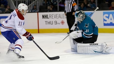 San Jose Sharks goalie Antti Niemi (31) stops a shot from Montreal Canadiens right winger Brendan Gallagher (11) during the second period Saturday. Canadiens Sharks Hockey