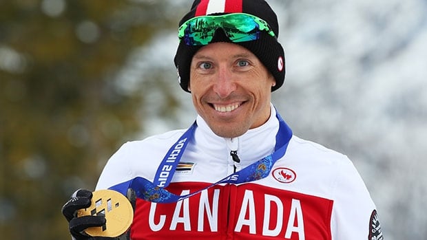 Canada's Chris Klebl poses with his gold medal won in the men's 10 km sitting cross-country race at the Paralympics in Sochi.