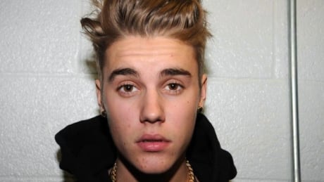 FILE - This Jan. 23, 2014 file photo made available by the Miami Beach Police Dept., shows Justin Bieber at the police station in Miami Beach, Fla. Bieber claimed after a shaky sobriety test following his Jan. 23 arrest that he was suffering from a hairline fracture in his right foot and made condescending comments about enjoying his wealth, according to a Miami Beach police document released Tuesday, March 18. Bieber, who has pleaded not guilty to driving under the influence and other charges, also told officers he was not drag racing in a rented Lamborghini along with R&B singer Khalil Amir Sharieff, who was driving a Ferrari when both were stopped. (AP Photo/Miami Beach Police Dept., File) Justin Bieber Arrest