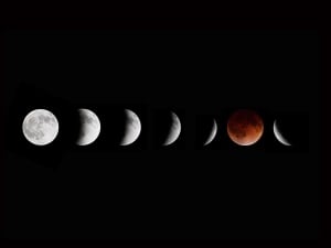 Multiple images of the moon are are seen in this illustration of the phases of the lunar eclipse over Winnipeg on April 15, 2014. A total lunar eclipse occurs when Earth casts its shadow over the moon. The lunar face can sometimes turn reddish, coppery-brown or orange, tinged by light from the sun that refracts as it passes through our atmosphere.