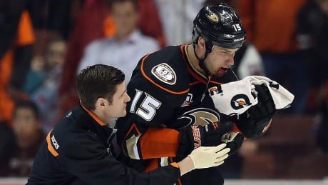 Ducks centre Ryan Getzlaf is helped off the ice by a member of the team's medical staff after being hit in the face with a puck late in the third period of Wednesday's 4-3 win over over Dallas. Getzlaf, who scored a goal and added an assist, is expected to play Game 2 in the best-of-seven first-round series on Friday. getzlaf-ryan