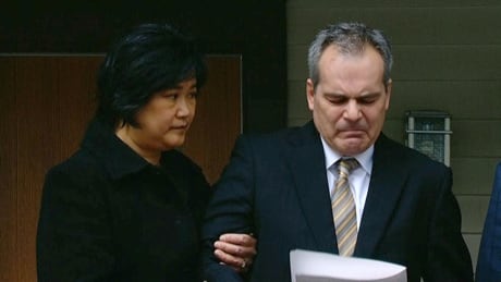 Calgary police Insp. Doug de Grood, with his wife Susan at his side, fights back tears as he speaks publicly for the first time since his son, Matthew de Grood, was charged with five counts of first-degree murder. Calgary police Insp. Doug de Grood