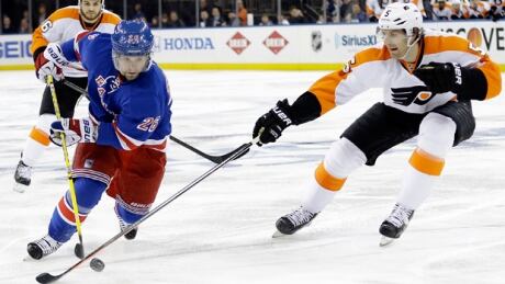 Martin St. Louis (26) bursts by Braydon Coburn of the Flyers in a 4-1 Rangers victory at Madison Square Garden on Thursday. st-louis-martin-140417