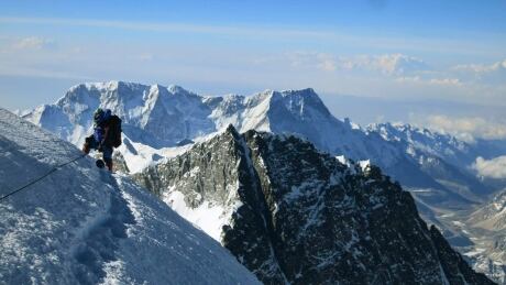 In this May 18, 2013 photo released by Alpenglow Expeditions, a climber pauses on the way to the summit of Mount Everest, in the Khumbu region of the Nepal Himalayas. Nepal will slash the climbing fees for Mount Everest to attract more mountaineers to the world's highest peak, even as concerns grow about the environmental effects of thousands of climbers who already crowd the mountain during the high season. Madhusudan Burlakoti, head of Nepal's Department of Mountains, said Friday, Feb. 14, 2014 that beginning next year, it will cost $11,000 per climber to climb Everest. (AP Photo/Alpenglow Expeditions, Adrian Ballinger) MANDATORY CREDIT, EDITORIAL USE ONLY Mount Everest avalanche