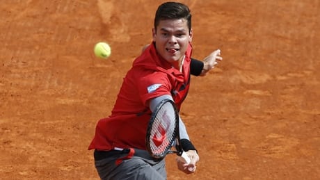 Canada's Milos Raonic hits a return to Swiss Stanislas Wawrinka during the Monte-Carlo ATP Masters Series Tournament tennis match, on April 18, 2014 in Monaco. AFP PHOTO / VALERY HACHE (Photo credit should read VALERY HACHE/AFP/Getty Images) raonic-140418-620
