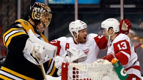 GAME 1: Detroit Red Wings' Pavel Datsyuk (13) is congratulated by teammate Johan Franzen after scoring against Boston Bruins goalie Tuukka Rask, left, during the third period in Boston on Friday. bruins red wings pavel datsyuk game 1