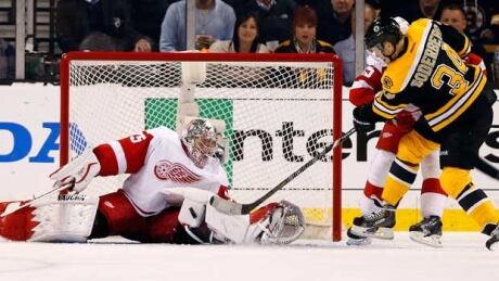 Detroit Red Wings goalie Jimmy Howard stopped everything he faced, including this bid from Boston forward Carl Soderberg. Jimmy Howard