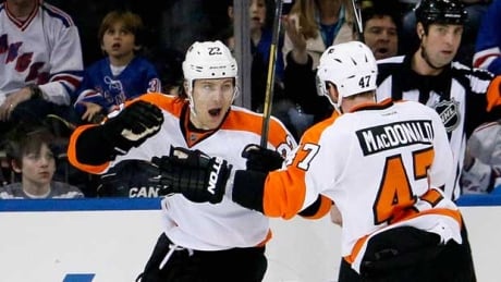 Philadelphia defenceman Luke Schenn celebrates his goal at Madison Square Garden on Sunday afternoon with teammate Andrew MacDonald. Luke Schenn