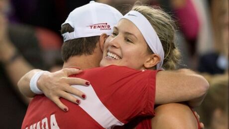 Eugenie Bouchard is embraced by Team Canada coach Sylvain Bruneau after a 7-6, 6-3 victory over Jana Cepelova on Sunday. bouchard-eugenie-140420