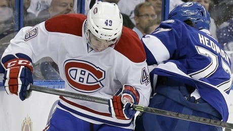 Michael Bournival (49) of the Canadiens jostles with Victor Hedman in Game 2 at the Tampa Bay Times Forum on Thursday. bournival-michael-140418