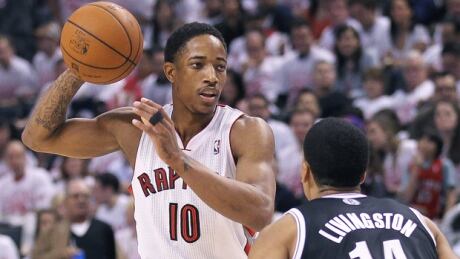 DeMar DeRozan (10) of the Raptors looks to pass on Shaun Livingston of the Nets in Game 1 at Air Canada Centre on Saturday. derozan-demar-140419