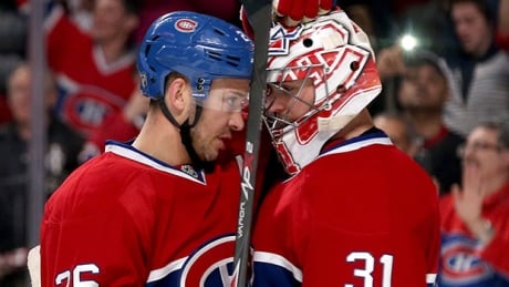 MONTREAL, QC - APRIL 20: Josh Gorges #26 and Carey Price #31 of the Montreal Canadiens celebrate a win against the Tampa Bay Lightning in Game Three of the First Round of the 2014 NHL Stanley Cup Playoffs at the Bell Centre on April 20, 2014 in Montreal, Quebec, Canada. (Photo by Andre Ringuette/Getty Images) price-gorges-140422-620