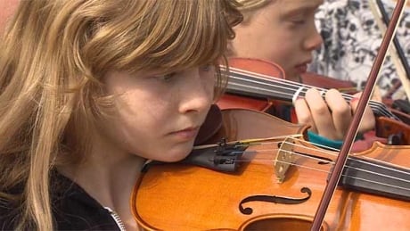 Students from the Vancouver School District music programs turned out to protest possible cuts before the board meeting on Tuesday. VSB string