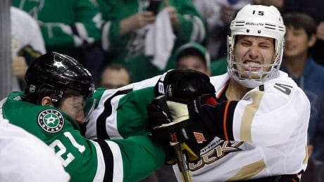 Ducks centre Ryan Getzlaf, right, is seen here getting roughed up by the Stars' Antoine Roussel in Game 3 of their first-round Stanley Cup playoff series on Monday. Getzlaf says the best way to answer any physical play is to score and win games. getzlaf-ryan-06221088