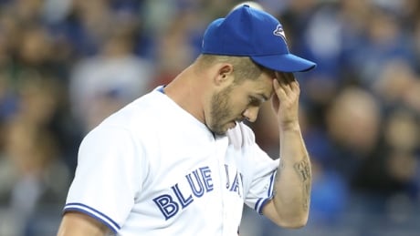 Toronto starting pitcher Dustin McGowan walks off the mound in disbelief during a 10-8 loss to Baltimore on Wednesday night. mcgowan-dustin-140423