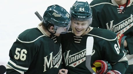 ST PAUL, MN - APRIL 21: Erik Haula #56 and Mikael Granlund #64 of the Minnesota Wild celebrate a win against the Colorado Avalanche in Game Three of the First Round of the 2014 NHL Stanley Cup Playoffs on April 21, 2014 at Xcel Energy Center in St Paul, Minnesota. The Wild defeated the Avalanche 1-0 in overtime. (Photo by Hannah Foslien/Getty Images) granlund-haula-620