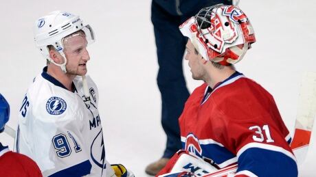 Lightning centre Steven Stamkos (91) shakes hands with Canadiens goalie Carey Price after Montreal swept Tampa Bay Tuesday night. price-stamkos-620