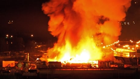 A large fire burns at the Lakeland Mills sawmill in Prince George, B.C., on Tuesday April 24, 2012. An explosion rocked the sawmill just before 10 p.m. local time setting off a fire that engulfed the facility. Prince George Mill Fire 20120423