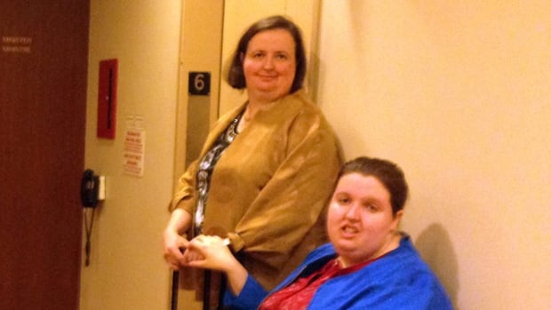 Linda Murphy and her daughter, Ashley, wait outside the office of Ontario Deputy Minister of Community and Social Services Marg Rappolt