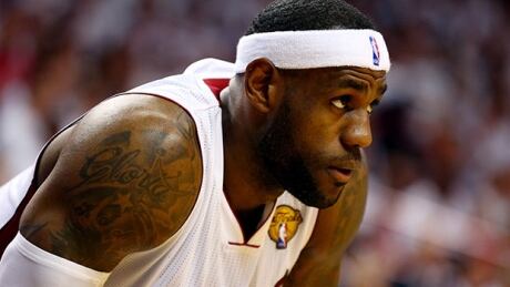 MIAMI, FL - JUNE 12: LeBron James #6 of the Miami Heat looks on against the San Antonio Spurs during Game Four of the 2014 NBA Finals at American Airlines Arena on June 12, 2014 in Miami, Florida. NOTE TO USER: User expressly acknowledges and agrees that, by downloading and or using this photograph, User is consenting to the terms and conditions of the Getty Images License Agreement. lebron-620