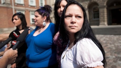 Timea Nagy, right, a former sex slave and victim of human trafficking, joins other former sex workers and activists against the legalization of prostitution while speaking to reporters outside the Court of Appeal for Ontario in Toronto Friday, June 17, 2011. Bawdy Law Change 20110617