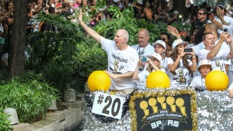 San Antonio Spurs coach Gregg Popovich, seen here participating in a victory parade after winning the 2014 NBA Championship on June 18 has agreed to a contract extension to remain coach of the team. 498357127_Spurs_Celebration_MURDOCH_JR_1214