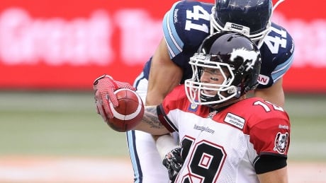 Stampeders quarterback Bo Levi Mitchell slides to a first down against the Argonauts on Saturday night in Toronto. Mitchell improved his record as a starter in the CFL to 5-0, passing for 268 yards and four touchdowns in a 34-15 victory. mitchell-bo-levi