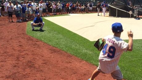 A young New York Mets fan had a dream come true Saturday when he had the chance to throw pitches to his favourite hurler, left-hander Jonathon Niese. Niese invited the youngster on the playing surface at Citi Field during batting practice after he noticed the boy was wearing a Mets uniform with his No. 49. boy-pitching