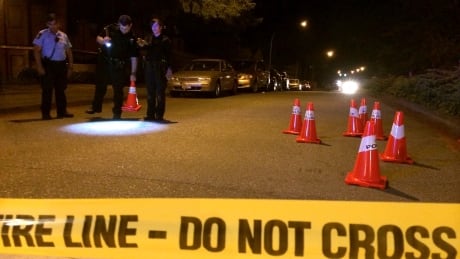 Police in Delta look for bullets and bullet casings after gunshots are reported near the intersection of Scott Road and Wade Road in the early hours of July 13, 2014. Delta Police - bullet search - July 13, 2014