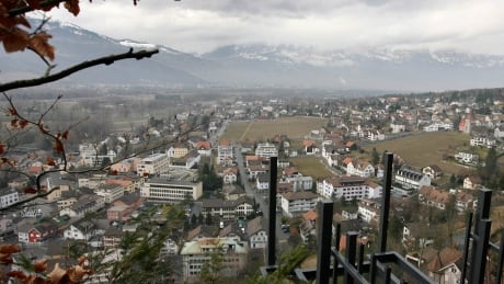 Clouds covers Vaduz, the capital of Liechtenstein on Feb. 21, 2008. The Canada Revenue Agency has 80 new leads on taxpayers who may be hiding money offshore after getting hundreds of calls on its new snitch line. Tax snitch line