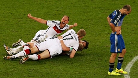 German players celebrate winning the World Cup Sunday as Argentina's Pablo Zabaleta, right, reacts in dejection at the Maracana stadium in Rio de Janeiro. germany-players-620