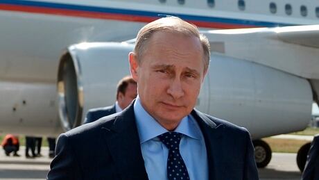 Russian President Vladimir Putin walks past his plane upon his arrival at the airport of Samara, Russia, July 21. Putin has lambasted those who use the downing of a passenger jet in eastern Ukraine for "mercenary objectives," the Kremlin said Monday. Russia Putin